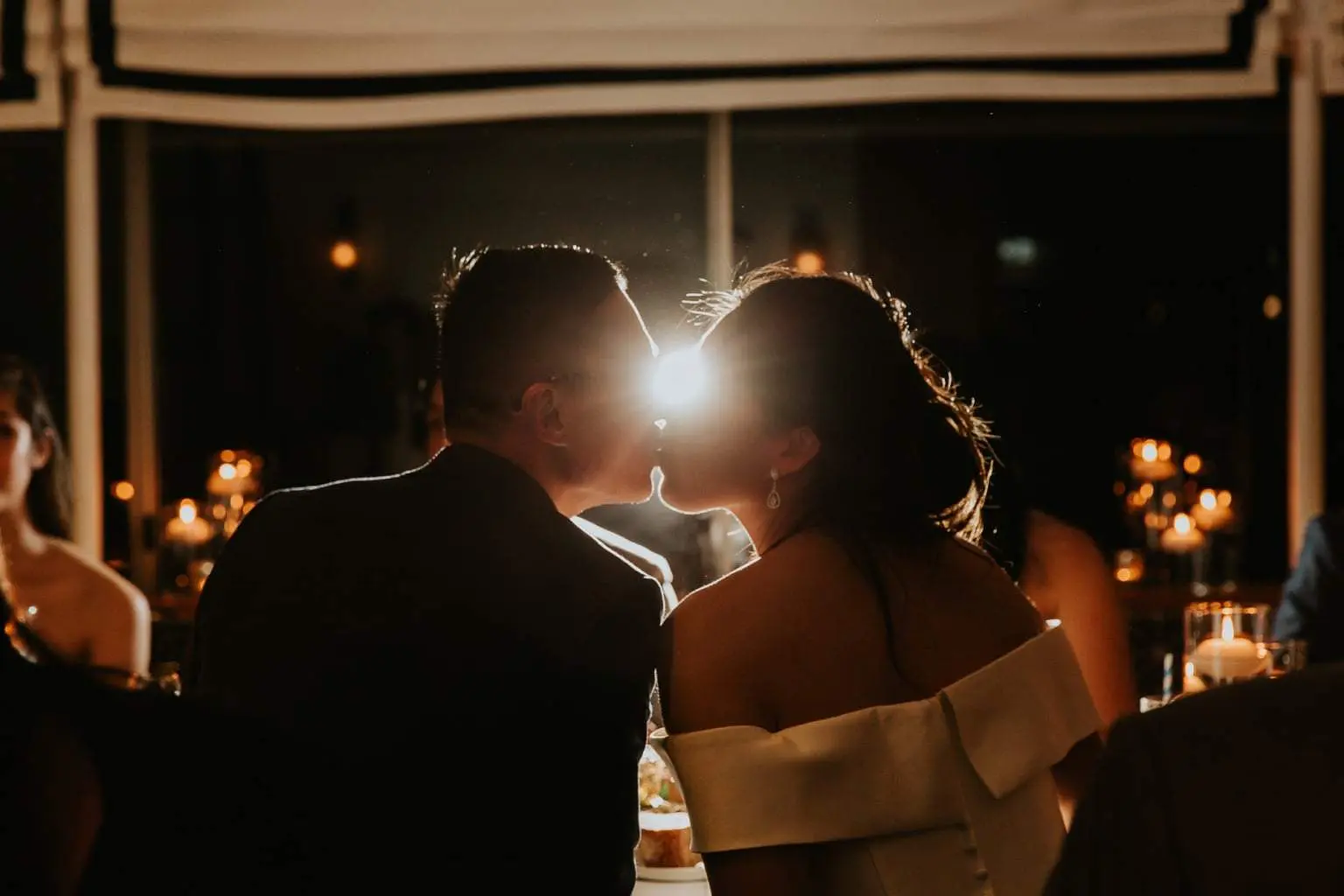 Wedding reception portrait in warm candlelight