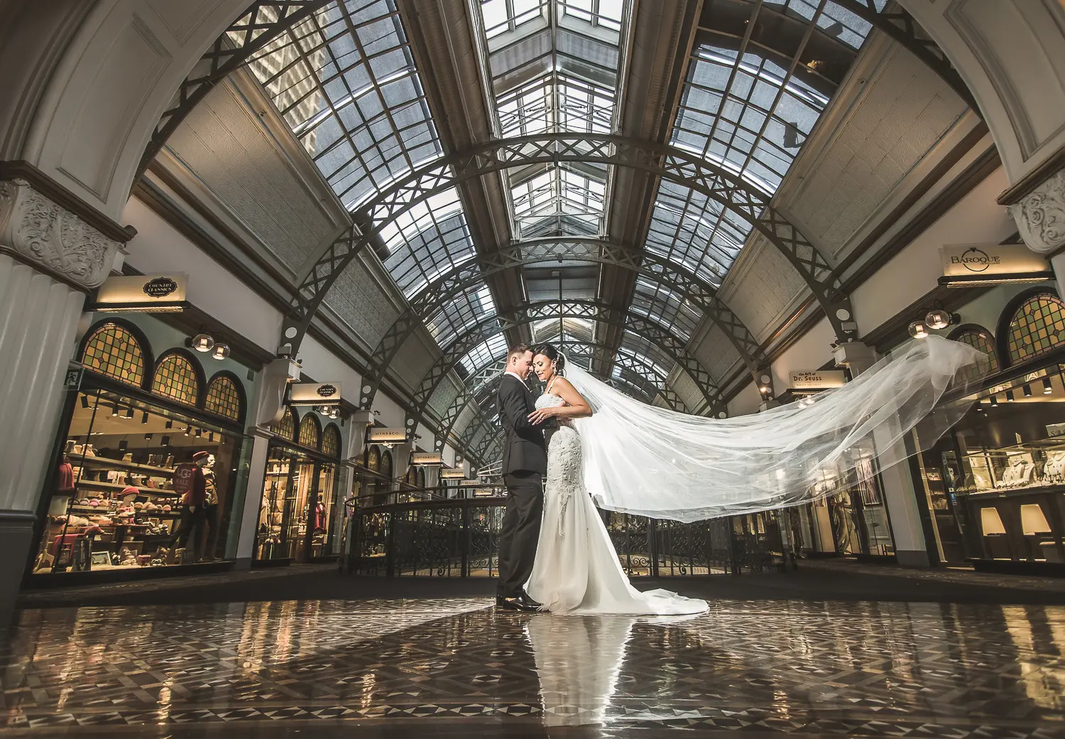 Wedding portrait beneath the glass roof of the Queen Victoria Building