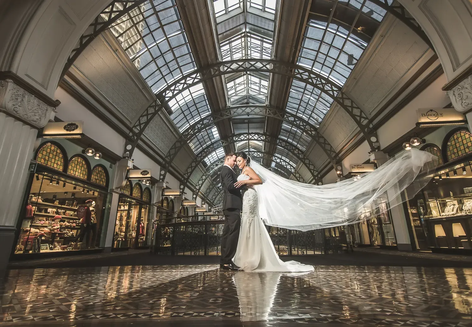 Wedding portrait beneath the glass roof of the Queen Victoria Building